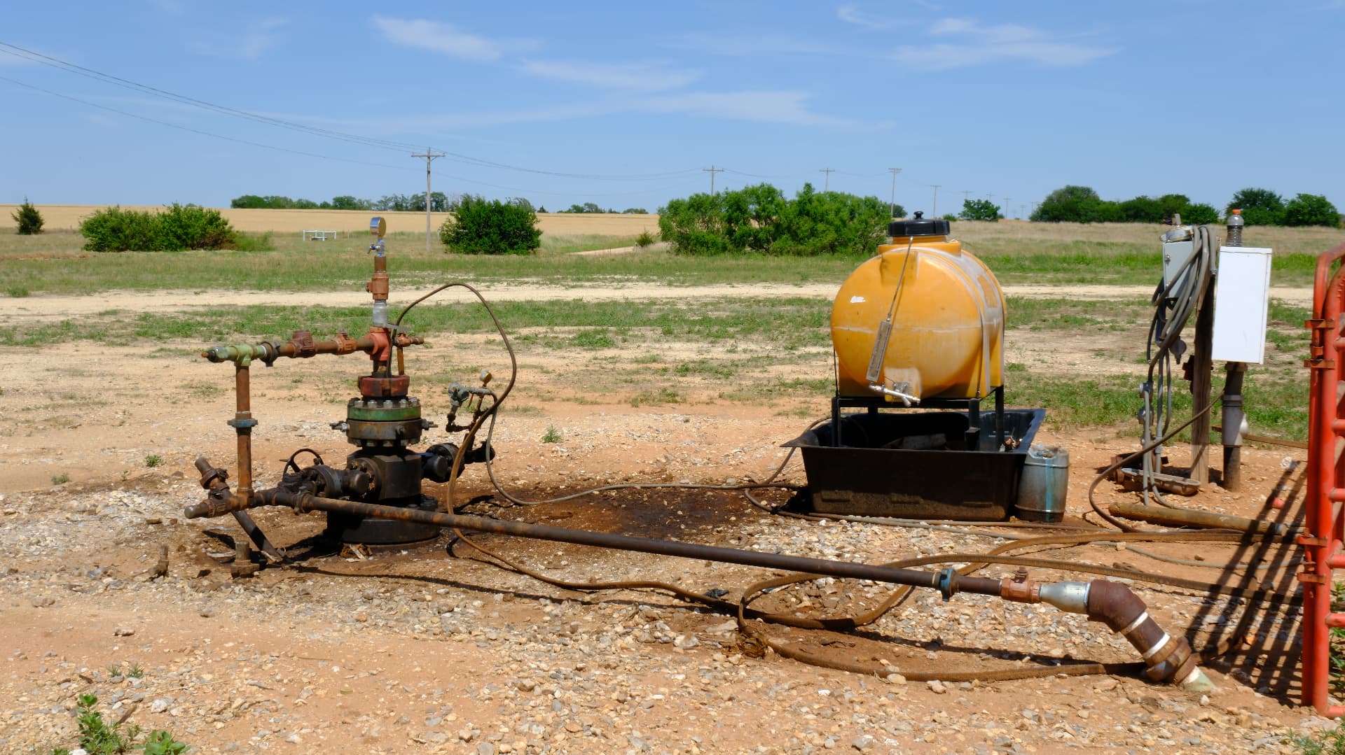 Wellhead with chemical pump and flow line on a producing lease
