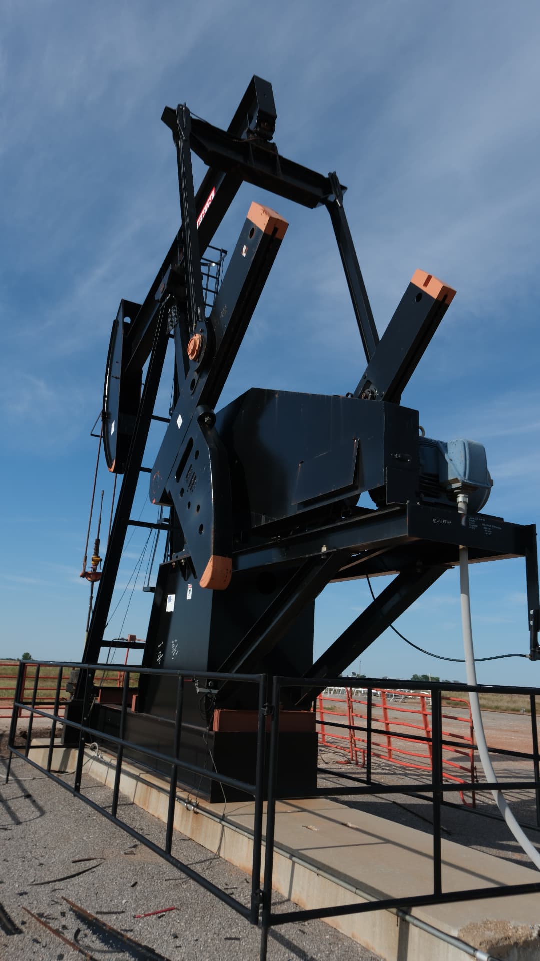 Modern pumping unit against open Kansas sky